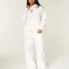Pantaloni de trening largi cu imprimeu Candy Cane Pantaloni de trening largi cu imprimeu Candy Cane