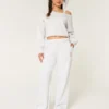 Pantaloni de trening largi cu imprimeu cu câini