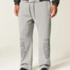 Pantaloni de trening largi cu imprimeu dublu cu șerpi Pantaloni de trening largi cu imprimeu dublu cu șerpi