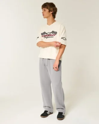 Pantaloni de trening largi cu imprimeu grafic Pantaloni de trening largi cu imprimeu grafic