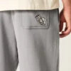 Pantaloni de trening largi cu imprimeu grafic Pantaloni de trening largi cu imprimeu grafic