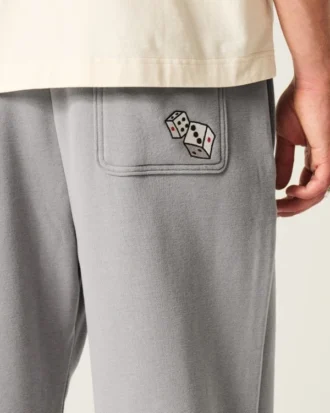 Pantaloni de trening largi cu imprimeu grafic Pantaloni de trening largi cu imprimeu grafic