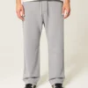 Pantaloni de trening largi cu imprimeu grafic Pantaloni de trening largi cu imprimeu grafic