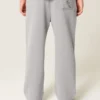 Pantaloni de trening largi cu imprimeu grafic Pantaloni de trening largi cu imprimeu grafic