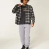 Pantaloni de trening largi cu tiv strâns Pantaloni de trening largi cu tiv strâns