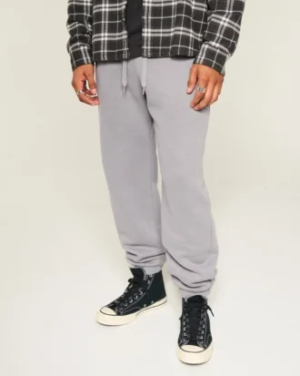 Pantaloni de trening largi cu tiv strâns Pantaloni de trening largi cu tiv strâns