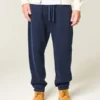 Pantaloni de trening largi cu tiv strâns Pantaloni de trening largi cu tiv strâns