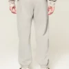 Pantaloni de trening largi cu tiv strâns Pantaloni de trening largi cu tiv strâns
