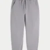 Pantaloni de trening largi cu tiv strâns Pantaloni de trening largi cu tiv strâns