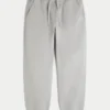 Pantaloni de trening largi cu tiv strâns Pantaloni de trening largi cu tiv strâns