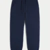 Pantaloni de trening largi cu tiv strâns Pantaloni de trening largi cu tiv strâns