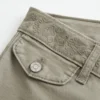 Pantaloni evazați cu talie brodată ultra joasă Pantaloni evazați cu talie brodată ultra joasă