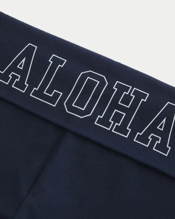 Pantaloni evazați cu talie pliată și imprimeu Aloha Pantaloni evazați cu talie pliată și imprimeu Aloha
