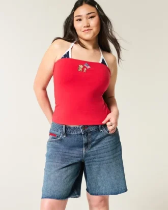 Pantaloni scurți baggy cu talie joasă, spălare închisă și imprimeu cu steagul american