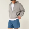 Pantaloni scurți de fotbal largi, până la jumătatea coapsei Pantaloni scurți de fotbal largi, până la jumătatea coapsei