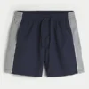 Pantaloni scurți de fotbal largi, până la jumătatea coapsei Pantaloni scurți de fotbal largi, până la jumătatea coapsei