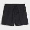 Pantaloni scurți de fotbal largi, până la jumătatea coapsei Pantaloni scurți de fotbal largi, până la jumătatea coapsei