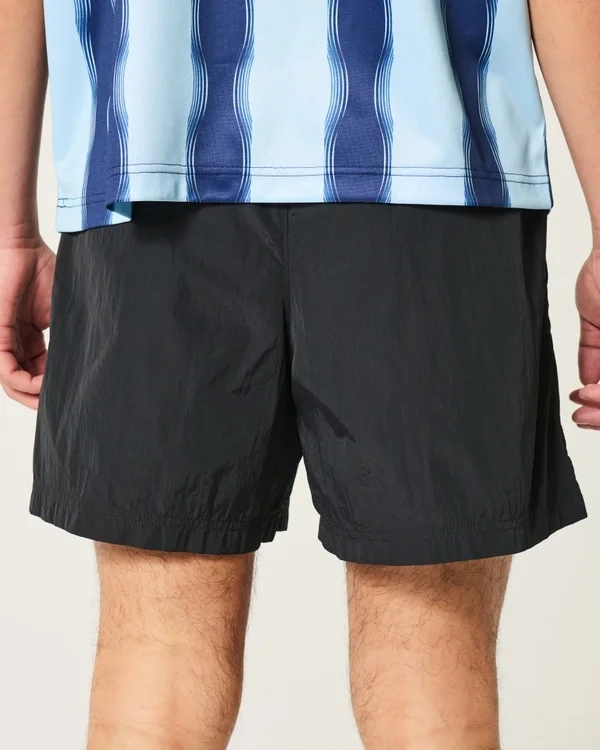 Pantaloni scurți de fotbal până la jumătatea coapsei Pantaloni scurți de fotbal până la jumătatea coapsei