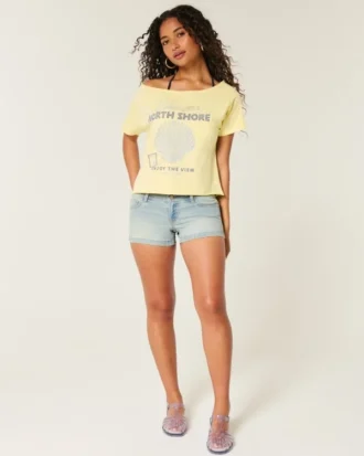 Pantaloni scurți din denim cu talie joasă, spălare deschisă și buzunare cu imprimeu floral Pantaloni scurți din denim cu talie joasă, spălare deschisă și buzunare cu imprimeu floral
