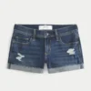 Pantaloni scurți din denim închis la culoare, cu talie joasă și rupturi Pantaloni scurți din denim închis la culoare, cu talie joasă și rupturi
