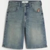 Pantaloni scurți din denim super largi, cu imprimeu Taz, spălați mediu Pantaloni scurți din denim super largi, cu imprimeu Taz, spălați mediu