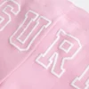 Pantaloni scurți din fleece cu imprimeu surf Pantaloni scurți din fleece cu imprimeu surf