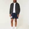 Pantaloni scurți din fleece până la jumătatea coapsei cu grafică UConn Huskies Pantaloni scurți din fleece până la jumătatea coapsei cu grafică UConn Huskies