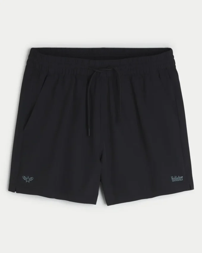 Pantaloni scurți sport cu logo la jumătatea coapsei Pantaloni scurți sport cu logo la jumătatea coapsei