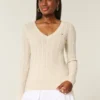 Pulover cu guler în V și model tricotat Pulover cu guler în V și model tricotat