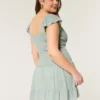 Rochie cu fustă-pantalon și mâneci fluturate Rochie cu fustă-pantalon și mâneci fluturate