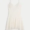 Rochie mini cu dantelă și tiv asimetric Rochie mini cu dantelă și tiv asimetric