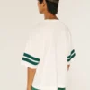 Tricou de fotbal cu grafică Michigan State University Spartans Tricou de fotbal cu grafică Michigan State University Spartans