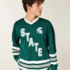 Tricou de hochei cu grafică Michigan State University Spartans Tricou de hochei cu grafică Michigan State University Spartans