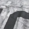 Tricou larg cu imprimeu camuflaj