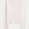 Tricou pentru bebeluși cu mâneci lungi, fără cusături, cu guler pătrat Tricou pentru bebeluși cu mâneci lungi, fără cusături, cu guler pătrat
